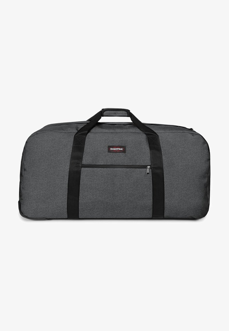 Borsa duffel grigia realizzata in tessuto testurizzato, con doppi manici neri, una tasca laterale con zip e una patch del logo sul davanti.