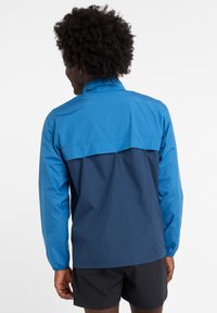 New Balance RUN JACKET - Windbreaker - blue