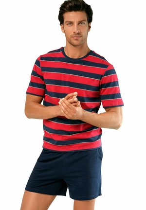 Red and navy striped T-shirt with crew neck, paired with navy shorts. Cotton material with a smooth texture, featuring thin stripes.
