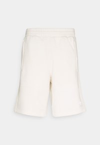 Krämfärgade shorts med resårmidja, sidofickor och en diskret logotyp på fållen. Tillverkade av mjukt material med en len yta.