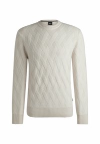 Maglione lavorato a maglia color beige chiaro con un motivo a diamante testurizzato, scollo rotondo e polsini e orlo a costine. Etichetta del marchio visibile al collo.