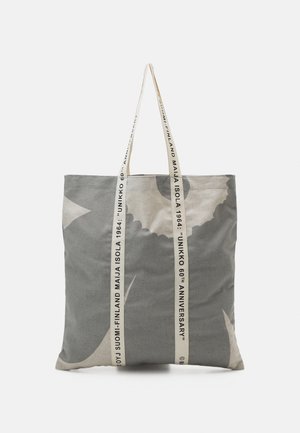 Sac cabas gris et beige avec un grand motif floral et des poignées crème imprimées avec "UNIKKO 60e anniversaire Maija Isola 1964 Finlande Suomi".