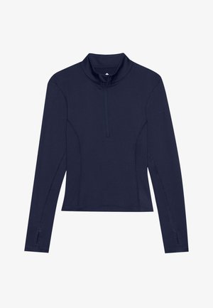 Chemise à manches longues bleue marine avec un col haut et une fermeture éclair quart, présentant des coutures latérales et des trous pour les pouces pour un design ajusté.