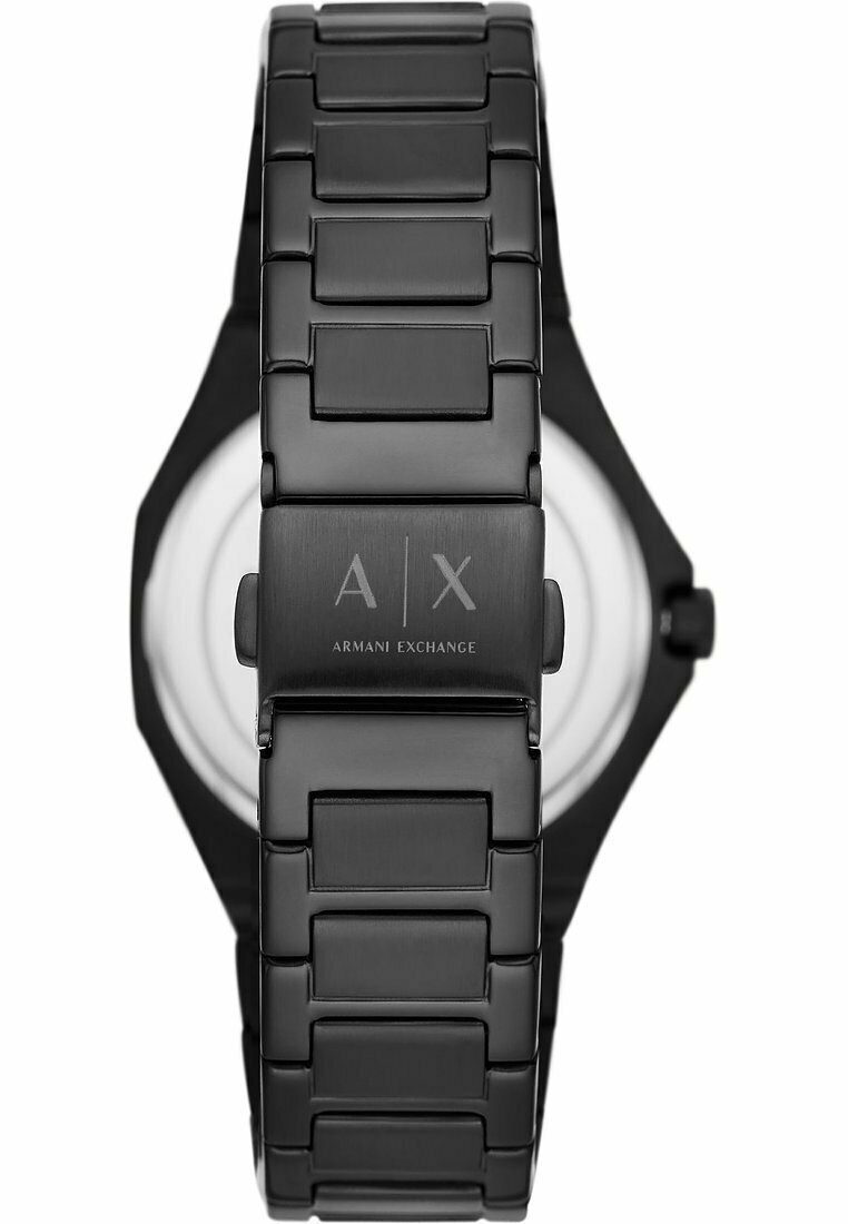 Reloj de acero inoxidable negro con pulsera de eslabones, caja octagonal y logo grabado. Presenta una esfera blanca y un diseño minimalista.