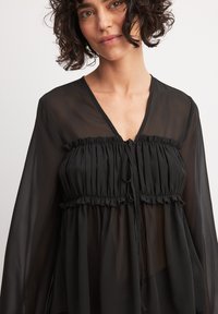 NA-KD TIE DETAIL BALLOON SLEEVE - Camicetta - black