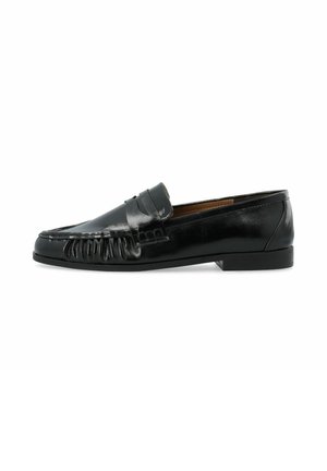 Black leather penny loafer with moc toe stitching, low heel, and slip-on design.