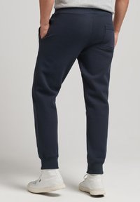 Superdry & Co Spodnie treningowe