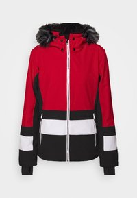 Chaqueta de invierno roja, negra y blanca con cremallera frontal, bolsillos laterales con cremallera y capucha decorada con pelaje sintético negro y gris.
