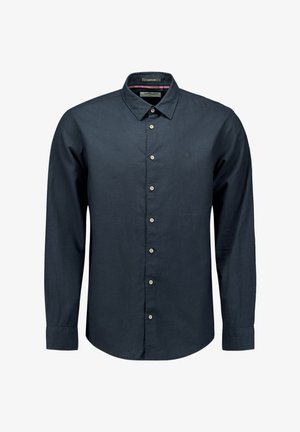 Donkerblauw langemouwen shirt gemaakt van een gladde stof. Kenmerkt zich door een opstaande kraag, knopen aan de voorkant en een subtiel logo op de borst.