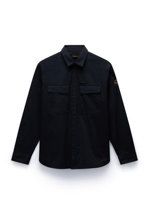 Black long-sleeve shirt with a button-down collar, two front pockets, and a logo patch on the sleeve. Smooth fabric with a structured design.