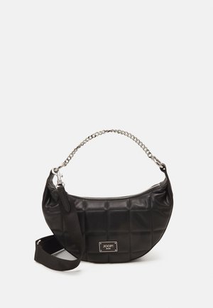 Black leather bag with a quilted design, silver chain handle, and detachable fabric strap. Features a front logo plaque and zip closure.