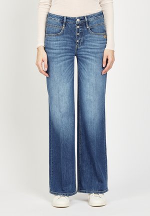 Wide-leg jeans in light blue denim with a five-button fly, two front pockets, and subtle fading. Features a straight hem and smooth texture.