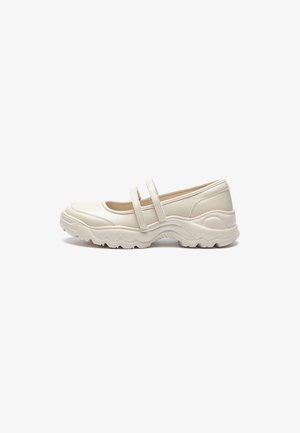 White synthetic shoes with two straps across the instep, featuring a rounded toe and a textured chunky sole. Smooth material finish.