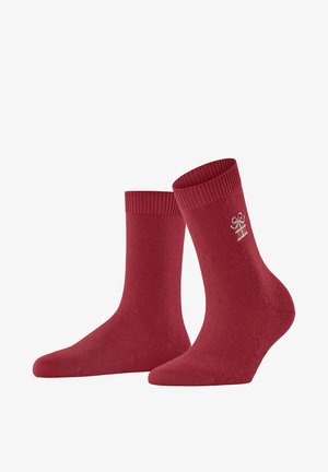 Rode katoenen sokken met geribbelde boorden en een subtiele geborduurde logo-detail. Het ontwerp heeft een gladde textuur en een standaard crewlengte.
