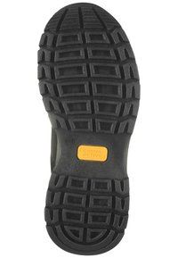 Suela de zapato de goma negra con un patrón texturizado para mayor tracción. Presenta un logo amarillo de "camel active". Diseño general robusto para una mayor durabilidad.