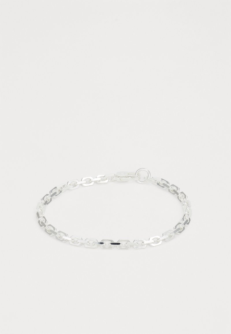 Silver chain bracelet made of interlocking links. Smooth, shiny texture with a simple design. Includes a clasp for secure fastening.
