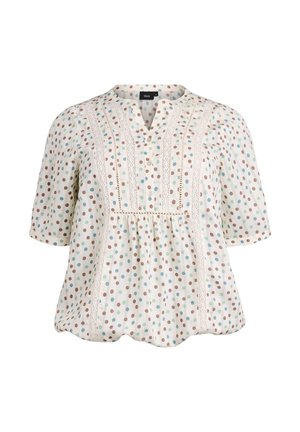 Blusa de manga corta, ligera, en color crema con lunares coloridos en azul verdoso y marrón. Presenta una tapeta con botones y detalles de encaje.
