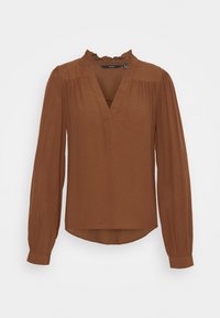 Blouse marron à manches longues avec col à volants, encolure en V, épaules froncées et poignets boutonnés, présentée sur un fond blanc.