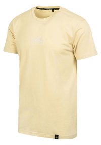 Beige Baumwoll-T-Shirt mit kurzen Ärmeln, mit weißem gesticktem Logo auf der Brust und einem schwarzen Etikett am Saum. Rundhalsausschnitt.