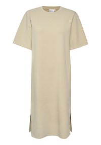 Beige, polvipituinen t-paita mekko, joka on valmistettu pehmeästä kankaasta. Siinä on lyhyet hihat ja sivureiät liikkumisen helpottamiseksi. Minimalistinen muotoilu ilman kuvioita.