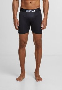 Caleçons boxers noirs avec une coupe ajustée, fabriqués en tissu lisse. La ceinture arbore un logo PSD marqué en blanc.