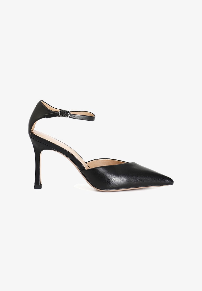 Black leather high-heeled shoe with a pointed toe, ankle strap, and a sleek design. Features a slender heel and a smooth, polished texture.