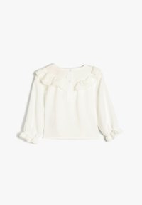Weißes Langarmshirt mit rüschigem Ausschnitt und elastischen Bündchen, mit einem Knopfverschluss am Rücken und aus einem weichen, strukturierten Stoff.