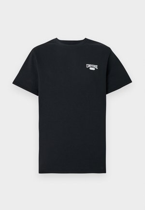 T-shirt noir en coton à manches courtes, avec un logo "Converse" blanc sur la poitrine gauche. Design classique à col rond.