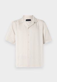 Kortermet beige skjorte med en subtil vertikal ribbet tekstur, knappelukking og spiss krage. Lett stoff.