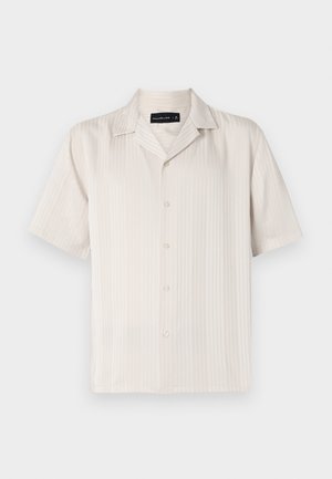 Short-sleeve beige shirt with a subtle vertical ribbed texture, button closure, and a pointed collar. Lightweight fabric.