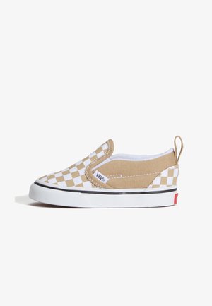 Beżowo-białe, w kratę, wsuwane buty Vans z białą gumową podeszwą i czarnym paskiem, pętelką z tyłu na pięcie oraz metką z logo Vans po boku.