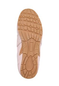 Semelle beige de chaussure de sport avec motif d’adhérence texturé, différentes formes et rainures, et le mot "Ecoplast" embossé au centre.