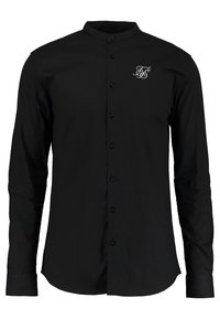 Zwart shirt met lange mouwen en een mandarijnkraag, voorzien van een knopenfront en een geborduurd wit logo op de linkerborst. Gladde stoftextuur.