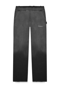 Black gradient sweatpants with an elastic waistband, side pockets, and logo detail. Material appears soft with a smooth texture.