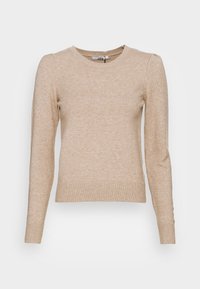 Beige neulepusero, jossa on pitkät hihat, pyöreä pääntie ja resorireuna. Pehmeä pinta, kevyt kangas, sopii kerrospukeutumiseen.