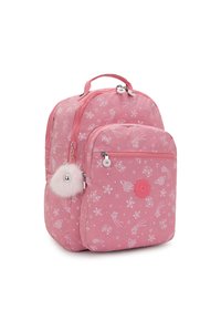 Vaaleanpunainen lasten reppu, jossa on valkoisia tähti- ja komeetta-kuvioita, etutasku vetoketjulla ja pörröinen tupsuavaimenperä kiinnitettynä sivuvetoketjuun.