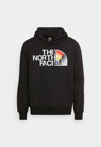 Felpa nera con cappuccio, tasca frontale, coulisse e un design grafico arcobaleno multicolore con il testo "THE NORTH FACE".