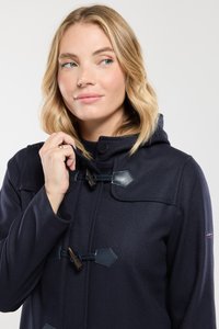 Marineblauwe hoodie gemaakt van een wolmix, met toggelsluiting, hexagonale patches en ribgebreide kraag. Gladde textuur met een op maat gemaakte pasvorm.
