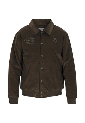 Ruda panne audeklo striukė su apykakle, sagų uždarymu ir raukiniais ant rankovių. Priekyje yra išsiuvinėtas tekstas ir inkaras.