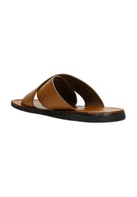 Braune Leder-Slidesandalen mit einem strukturierten Riemendesign, offenem Zehenbereich und einer flachen Gummisohle. Verfügt über geschwungene Riemen für einen modernen Look.