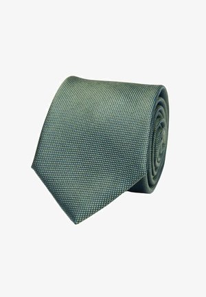 Teksturoidut vihreät solmiot, joissa on kudottu kuvio, kärjellinen pää ja esille kierrettynä. Väri on hienovaraisilla vaihteluilla ja syvyydellä.