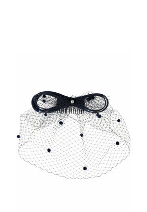 Black hair comb with bow and fine netting dotted with small pom-poms, designed as a decorative hair accessory.