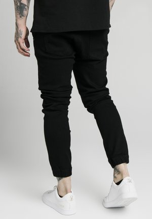 Vaqueros pitillo - black