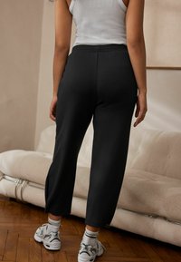 Next REGULAR FIT - Tepláky - black