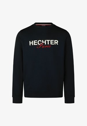 Dunkelblaues Sweatshirt mit rundem Halsausschnitt, langen Ärmeln und gerippten Bündchen. Mit den weißen und roten Buchstaben "HECHTER Paris" über der Brust.