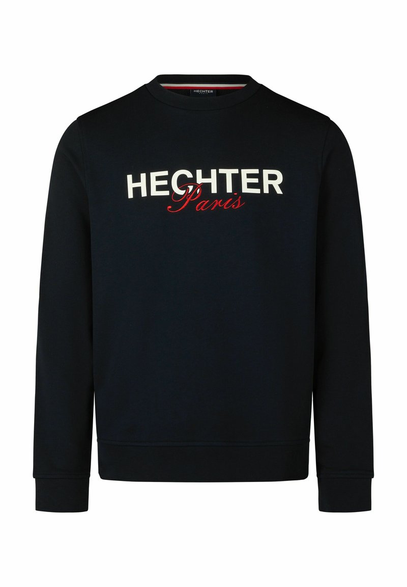 Dunkelblaues Sweatshirt mit rundem Halsausschnitt, langen Ärmeln und gerippten Bündchen. Mit den weißen und roten Buchstaben "HECHTER Paris" über der Brust.