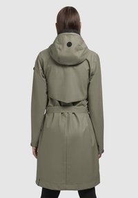 Olive green waterproof trench coat with a hood, belted waist, and back vent detail. Smooth texture, minimalistic design, and black accents.