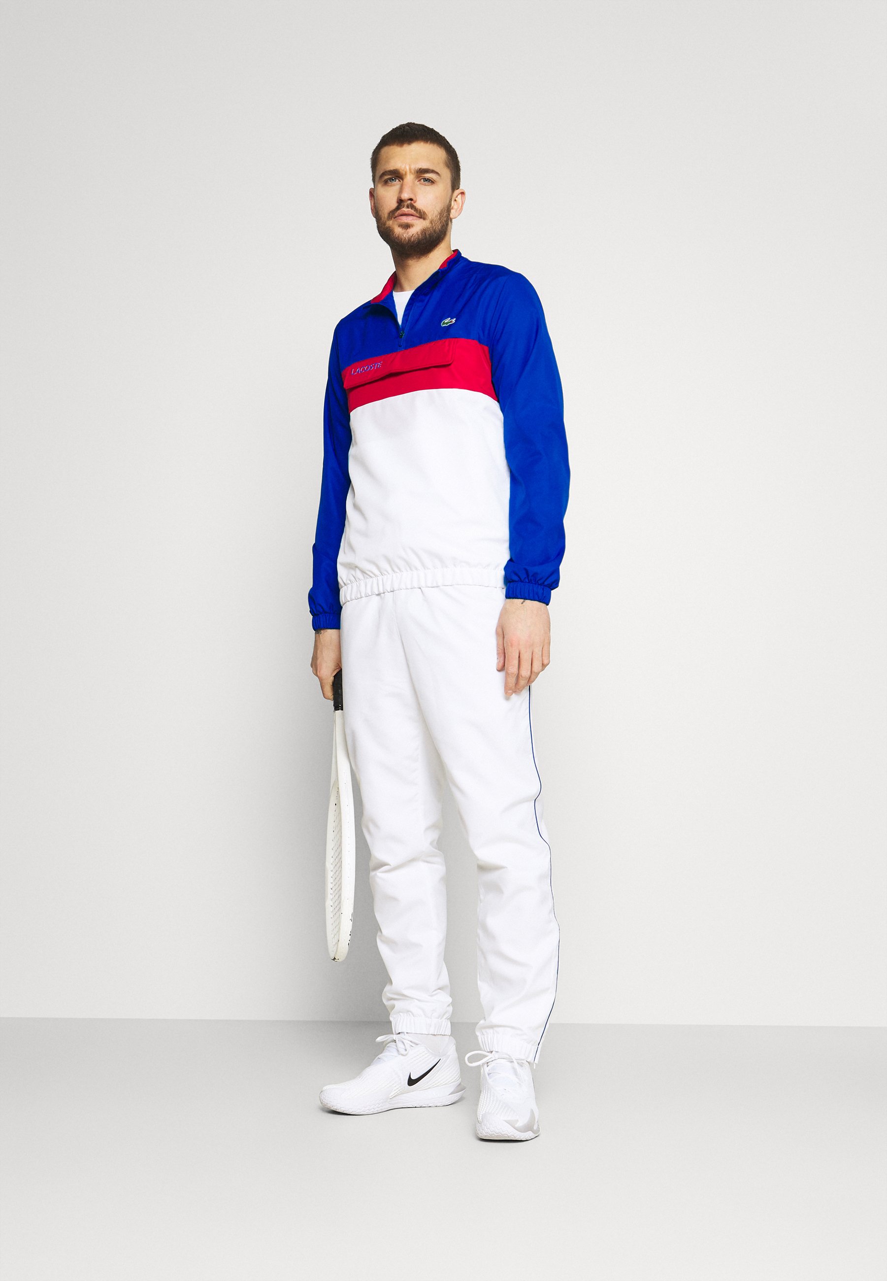 white lacoste joggers