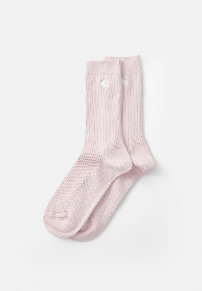 Chaussettes côtelées rose clair avec des boutons blancs en accent près du haut, fabriquées en tissu doux pour le confort et l'ajustement. Texture lisse tout au long.