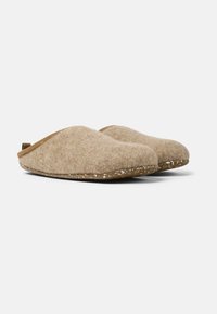 Wool slippers with a beige textured upper, smooth rounded shape, and a speckled brown sole. Features a pull tab for easy wear.